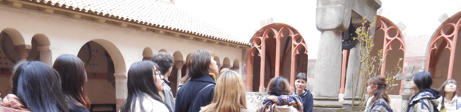 image banner of a group visiting a building